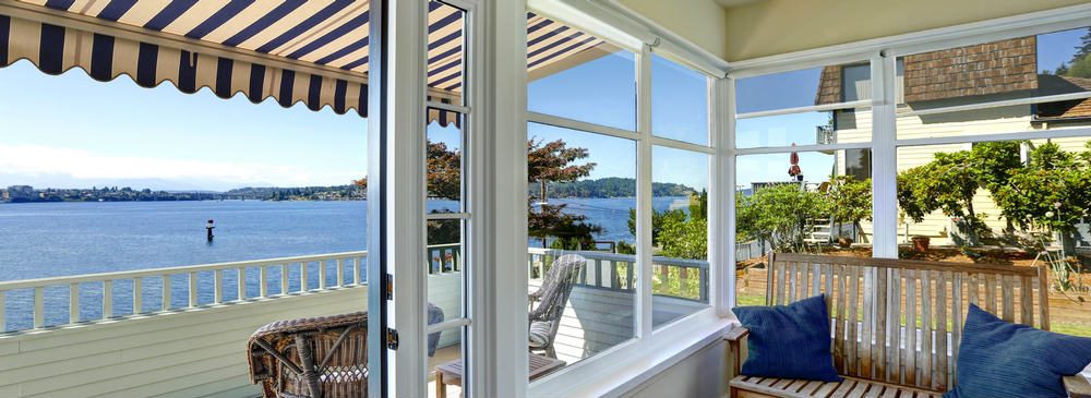 A view of the ocean from inside a house.