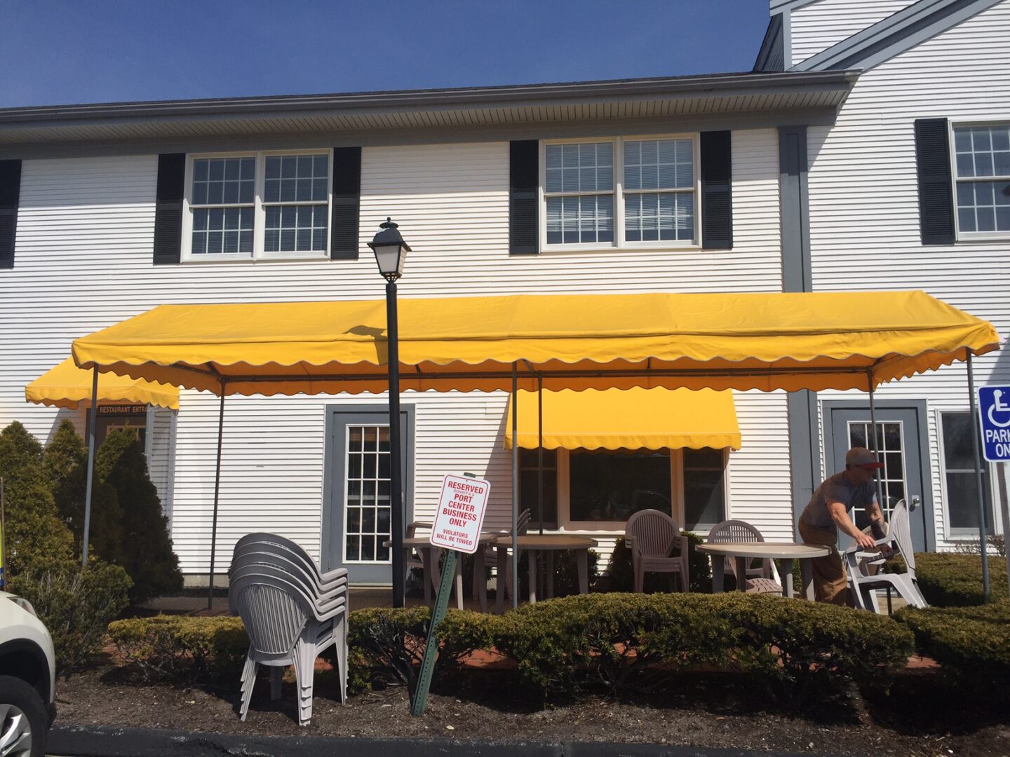 A yellow awning over the top of a building.