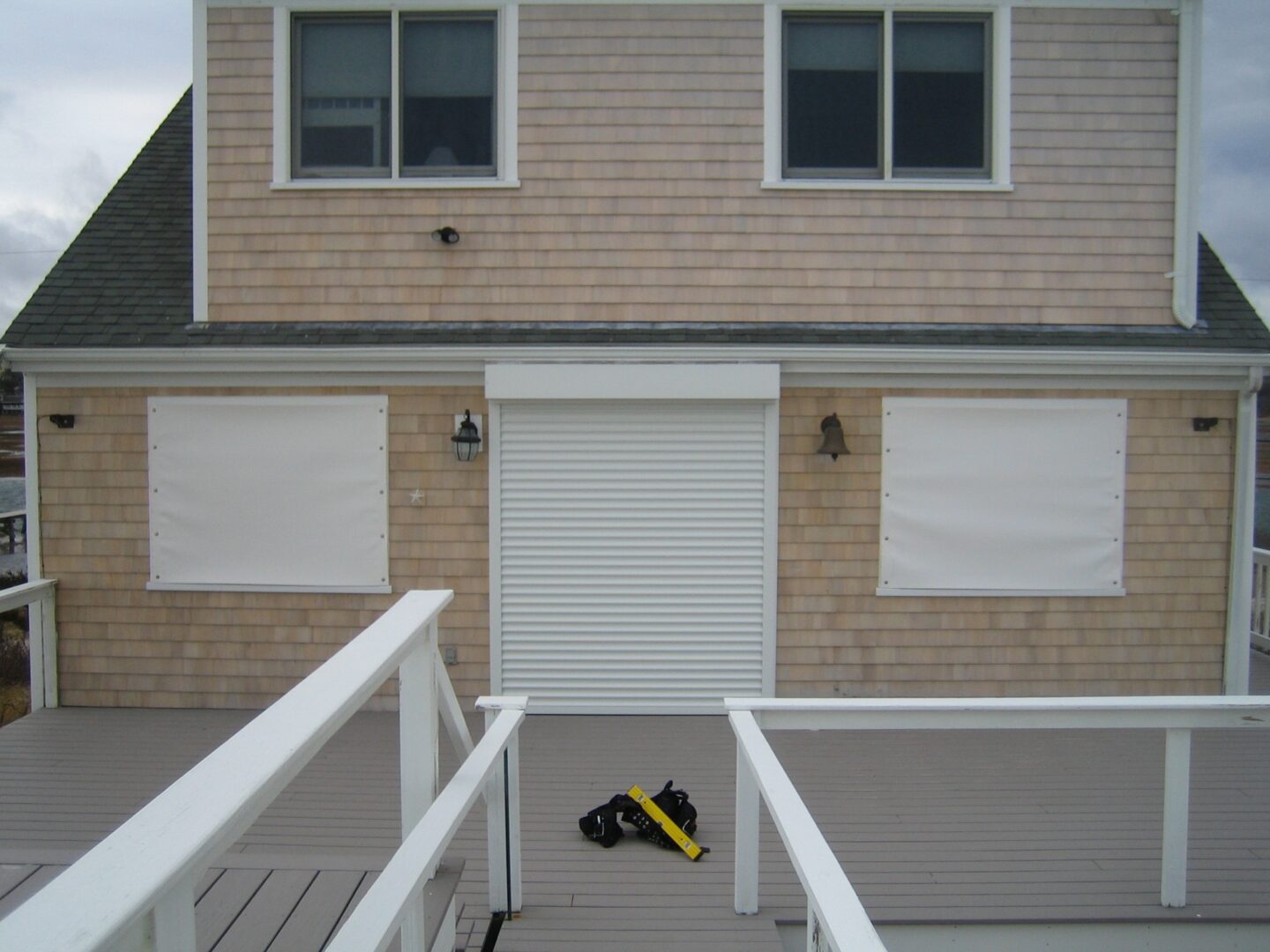 A yellow and black bag sitting on the ground.