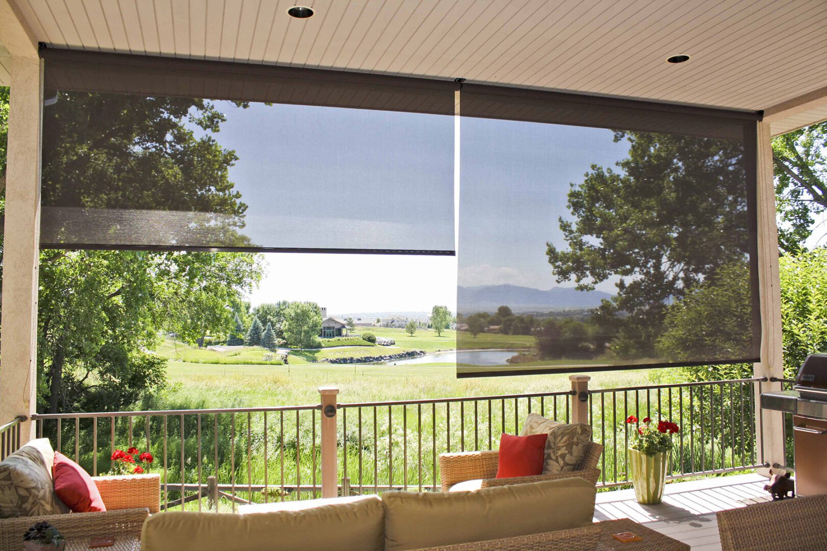 A patio with a couch and table outside